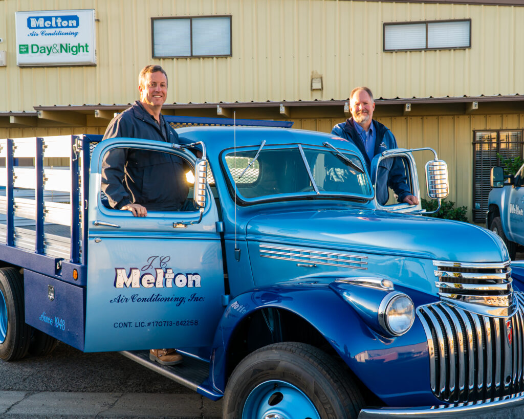 JC Melton Air Conditioning President (right) and Vice President (left) on a company vehicle