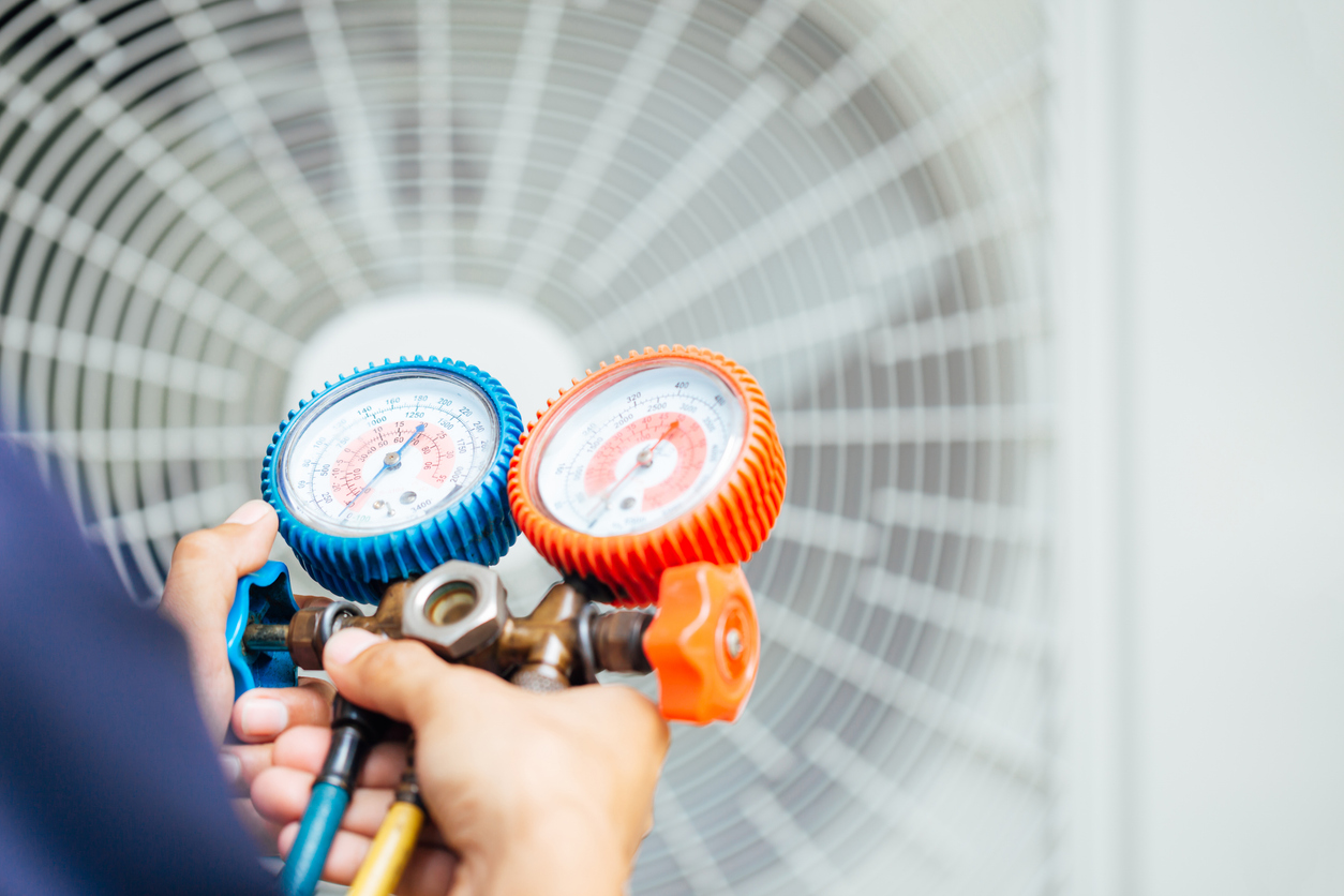 JC Melton technician performing an AC inspection