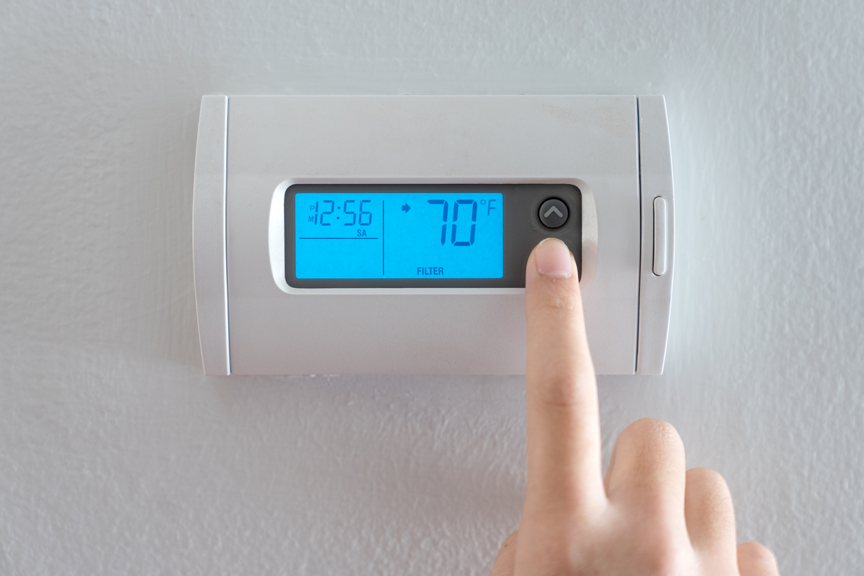 Digital thermostat showing heating settings