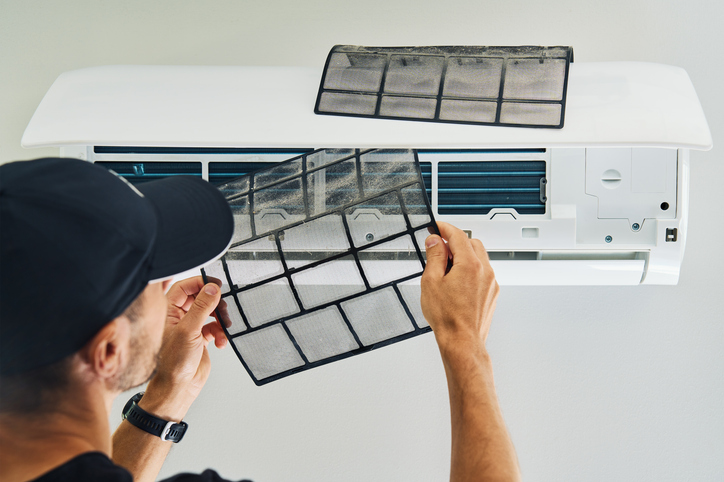 HVAC maintenance being performed in a Clovis home